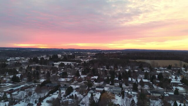 Colourful Sunrise In The Sky Over A Snow Covered Rural Town In Alton, Caledon, Ontario, Canada.