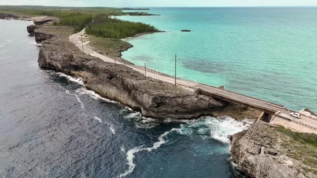 Aerial view of Glass Window Bridge separating the dark Atlantic from turquoise Caribbean waters Gregory Town, North Eleuthera, The Bahamas.