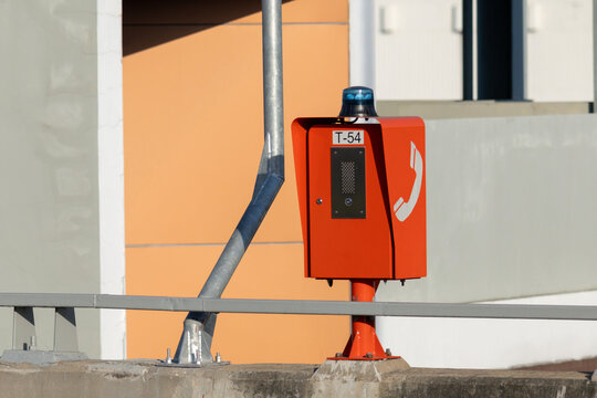Red emergency call box with blue light