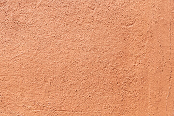 Fototapeta premium Terracotta textured wall background. Orange painted surface