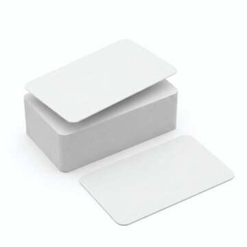 A stack of blank white index cards in a box