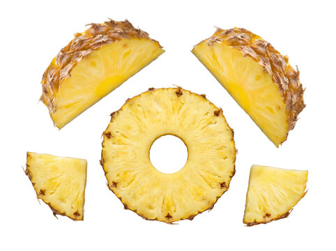 Vibrant photograph of fresh pineapple slices and wedges, beautifully arranged and isolated on transparent background.