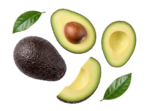 Fresh whole and sliced avocados with green leaves, showcasing healthy fruit isolated on a transparent background.