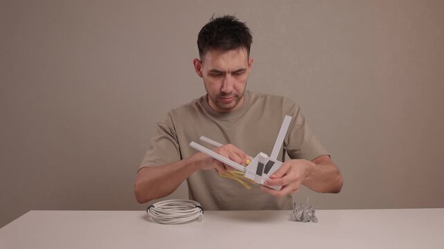 Tech setup process. Installing network cables precisely. Organizing ethernet connections professionally indoors. Detailed view of indoor network wiring procedures