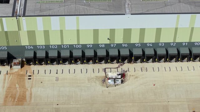 Aerial view of the New Build Supermarket Distribution Centre showing numbered loading bays and modern industrial architecture in Nuneaton, England, United Kingdom.