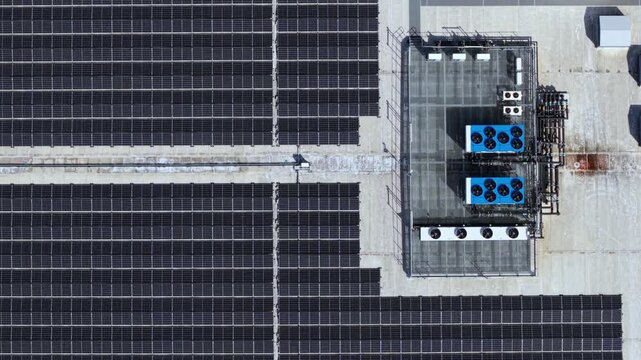 Aerial view of the new build supermarket distribution centre with solar panels and cooling units in Nuneaton, England, United Kingdom.