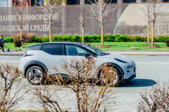modern electric car Zeekr X driving on a city road