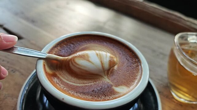 Spoon scoop in latte art.