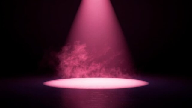 Pink smoky spotlight on dark stage with dramatic lighting effect for performance or event background