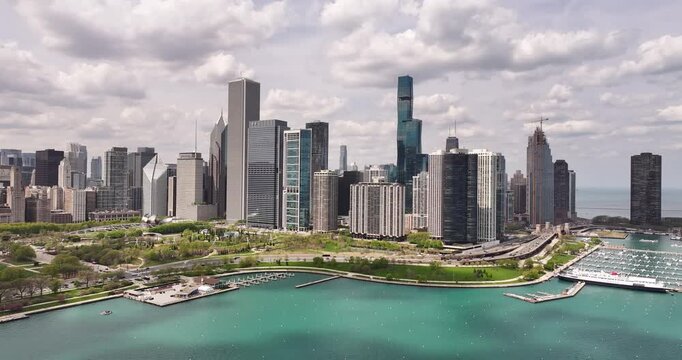  Aerial Drone View of Chicago Skyline Along Lake Michigan with Lakefront Trail and DuSable Lake Shore Drive on Clear Spring Afternoon April 23 2026