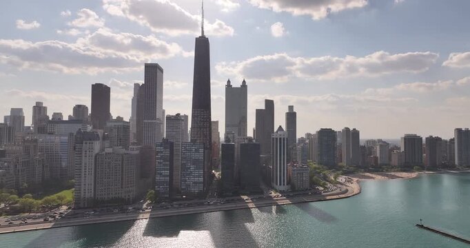Aerial View of Chicago Skyline from Lake Shore Drive with Dramatic Clouds Behind Skyscrapers&rdquo; on April 23 2026