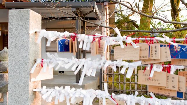 Traditional Japanese Ema Wooden Plaques and Omikuji Fortune Papers at Shinto Shrine