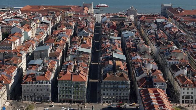 Aerial view of the historic Baixa district rooftops and narrow streets leading to Praca do Comercio in Lisbon, Lisbon, Portugal.