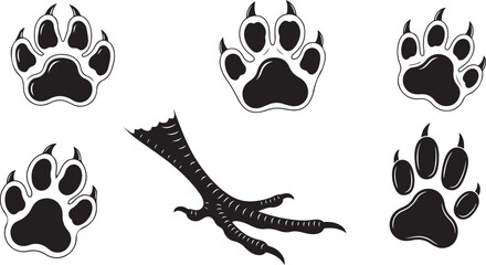 Fototapeta premium A collection of various black animal footprints, including canine or feline paw prints and three-toed bird tracks, perfect for nature and wildlife themes.