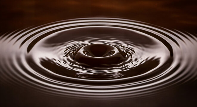 Molten Dark Chocolate Drop Splash Creating Perfect Concentric Ripples