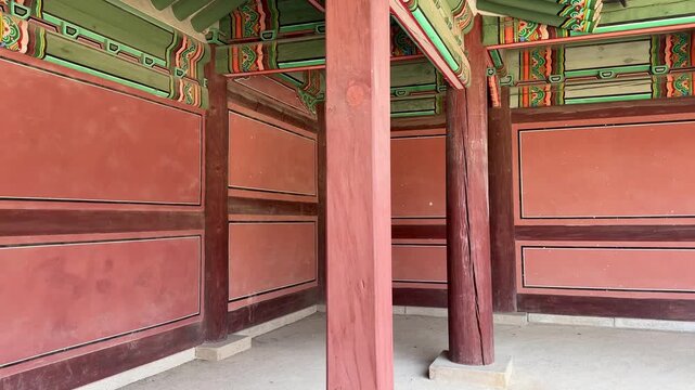 Architectural view of Changdeokgung courtyard with open walkway and columns.