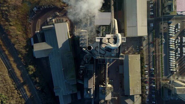 Drone shot over the limestone storage and raw material processing area of a cement works.