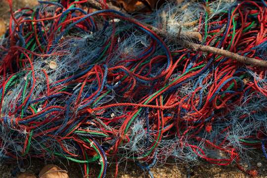 Weathered rope and string showing textures and patterns caused by long periods outdoors