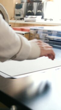 Press business - worker works at polygraph machine, printing industry