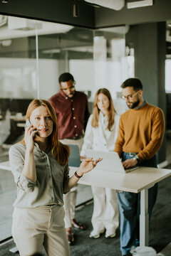 Dynamic teamwork in a modern office setting during a brainstorming session