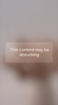 Social Media Sensitive Content Warning Message on Blurred Background
