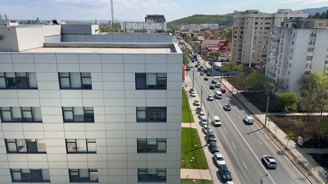 Timelapse of traffic on Poitiers Boulevard in Iasi Romania with cars moving through residential and commercial urban area