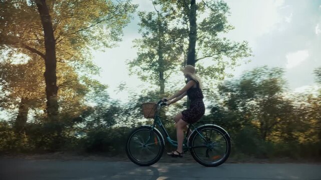 Traveler Enjoying Leisure Bike Ride under Sunlight. Outdoor Recreation in Nature. Weekend Hobby