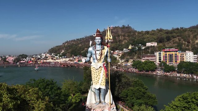 orbit drone view of lord shiva statue located at swami vivekanand park in haridwar.