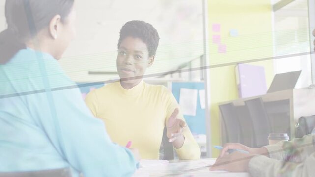 Vertical video: Lead starting biz mtg, pointing docs and handing pen for planning, lines overlaying