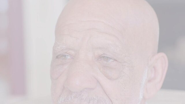 Diagonal dotted overlay fading as senior male opening eyes, glancing left then upward for health