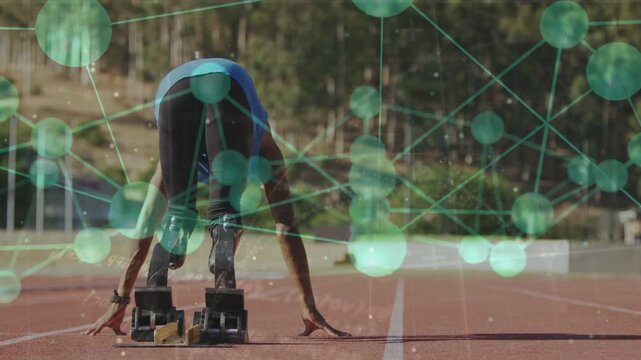 Teen athlete adjusting blades and hands at blocks, green network overlay showing sprint readiness