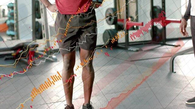 Gym client placing pink band doing one-leg march for balance coach watching overlays sweeping frame