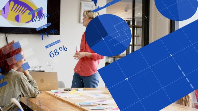 Presenter stepping and pointing at display, causing blue chart overlays while showing business data