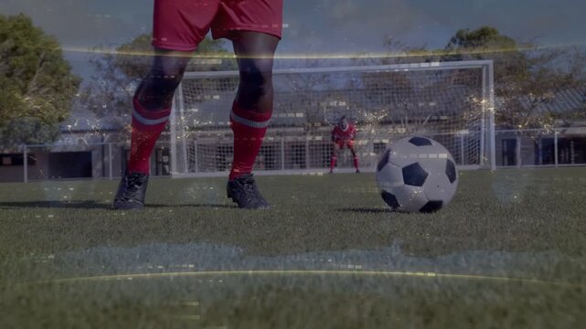 Soccer attacker starting dribble with light touch on ball outside box, doing feints to beat keeper