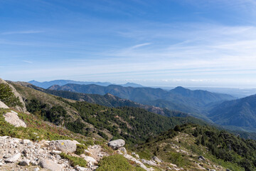 Fototapeta premium Mountain peaks in Corsican landscape under blue sky