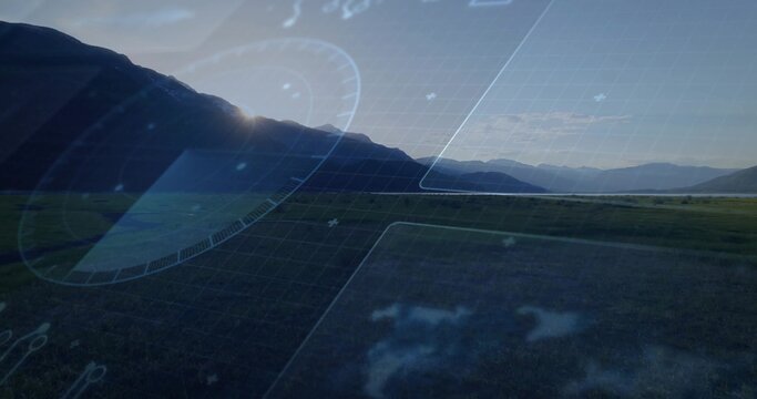 Displaying mountain valley with backlit ridge and grassy plain, showing faint HUD grid and gauges