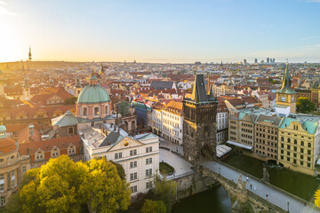 Fototapeta premium Located at Charles Bridge, the Old Town Bridge Tower stands tall against the evening sky. Its historic architecture offers a stunning view of Prague's skyline and the Vltava River below.