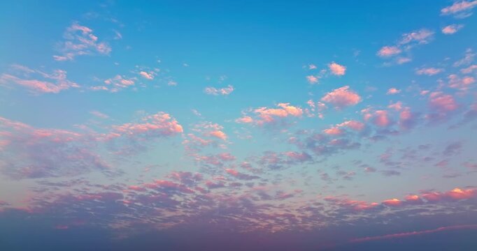 Pastel sunset sky with soft pink and orange clouds at twilight