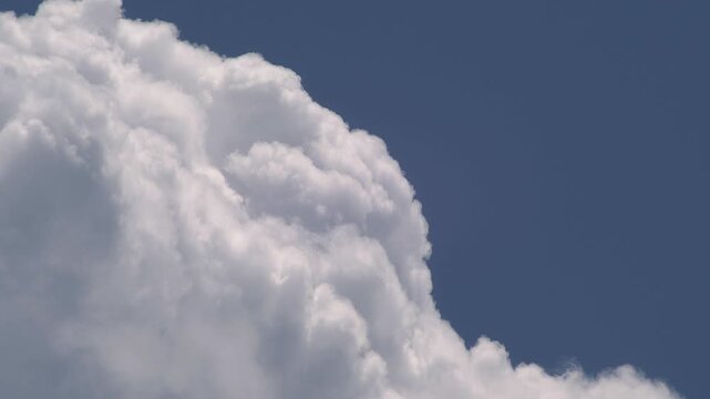 Turbulent Cumulus Cloud Boiling Against Deep Blue Sky High Contrast
