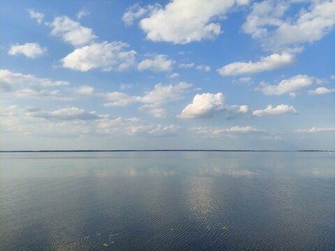 Dnieper river landscape in Balyko-Shchuchynka, Ukraine. Calm water and blue sky