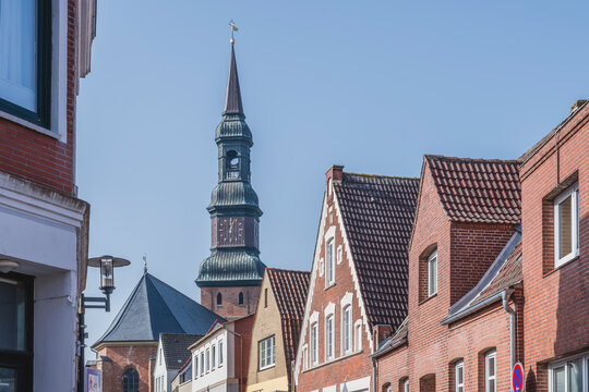 Historic St. Laurentius Kirche tower and brick houses in Tonning