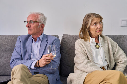 Couple enjoying quality time and wine on sofa at home