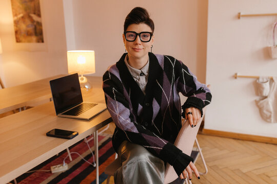 Creative director sitting at desk in modern office