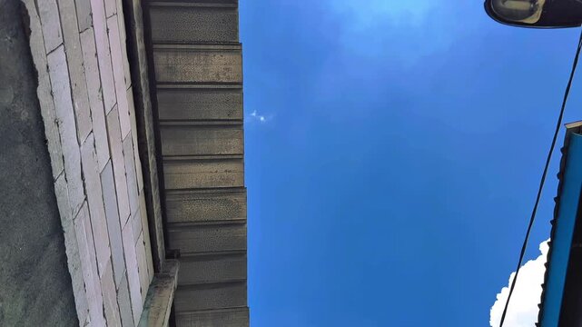 zinc roof of house with bright blue sky in the afternoon