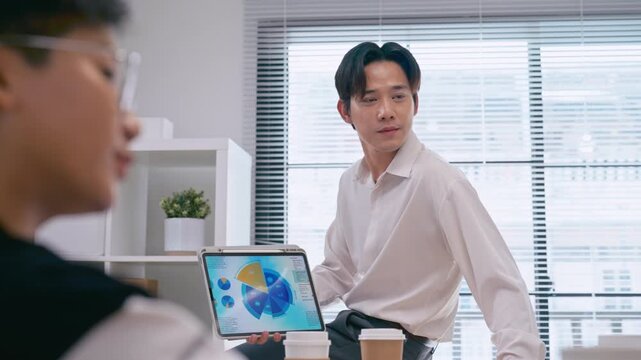 Asian business man presentations slides chart graphs of work professionals collaborating project meeting in a modern office. Brainstorming innovative ideas for a new business .