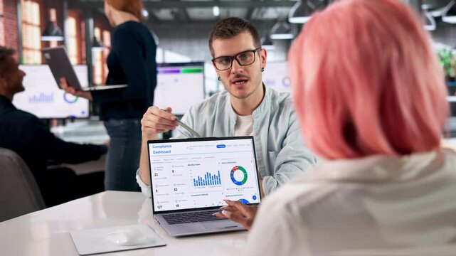 Compliance Officer Reviews Dashboard Data