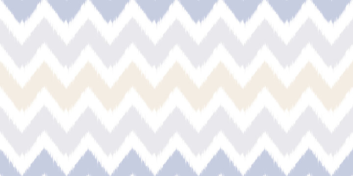 Ethnic seamless pattern with ikat geometric motif. Abstract vector rug textured traditional zigzag background. Chevron ornament for fabric textile and carpet.