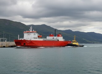 Fototapeta premium Red ferry ship being assisted by a yellow tugboat in a fjord