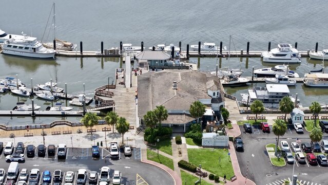 Aerial view of boats docked in the marina, cars in the parking lot and a building on the pier, Fernandina Beach, Florida, United States.