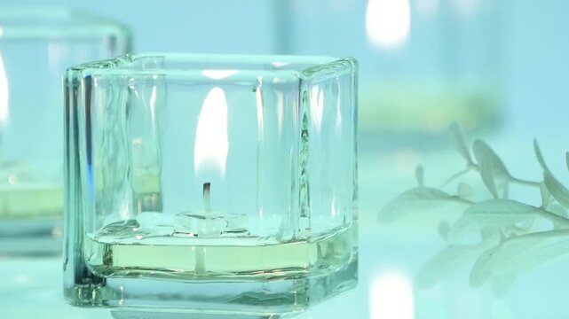 Candle in glass from left side, mid distance, relaxing and calm atmosphere